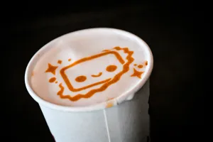 Close up of a coffee printed with Houston on it.