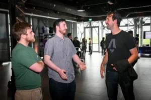 Fred, steward of the Astro project, speaking in a group with a couple maintainers.