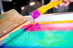 Closeup of the paint-like material used in a t-shirt printing press.