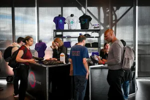 Guests at the swag bar retrieving their belted bags and t-shirts.