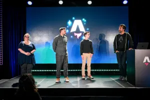 Keynote speakers on stage. From left to right: Sarah Rainsberger, Matthew Phillips, Ben Holmes, and Fred K. Schott (next to the podium). Fred answers the question while facing the rest of the keynote speakers.