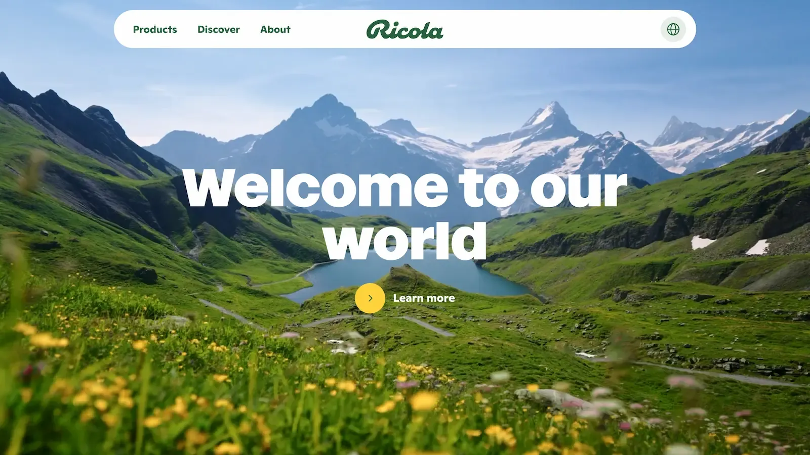 Ricola - Welcome to our world on a background image of alps and lush green hills.